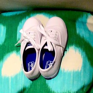 Girls Keds white sneakers.